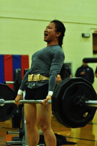 Sgt. Cat Mai, a reservist medic assigned to the 191st Infantry Brigade on Joint Base Lewis-McChord, musters the strength to pull up 165 pounds of weight at Sheridan Sports and Fitness Center Saturday during the dead lift portion of the 2010 annual JBLM bench press and dead lift championship.
